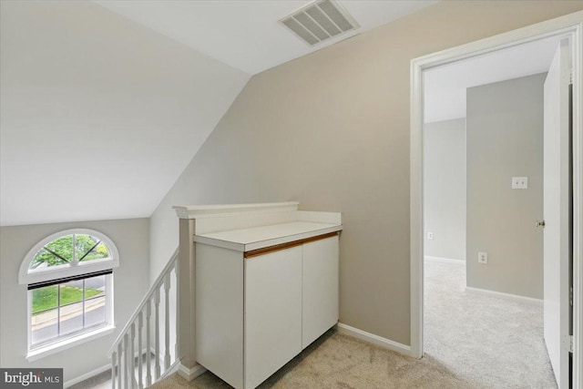 10204 Faire Commons Ct, Burke, VA 22015 - hall with an upstairs landing, lofted ceiling, light carpet, and baseboards