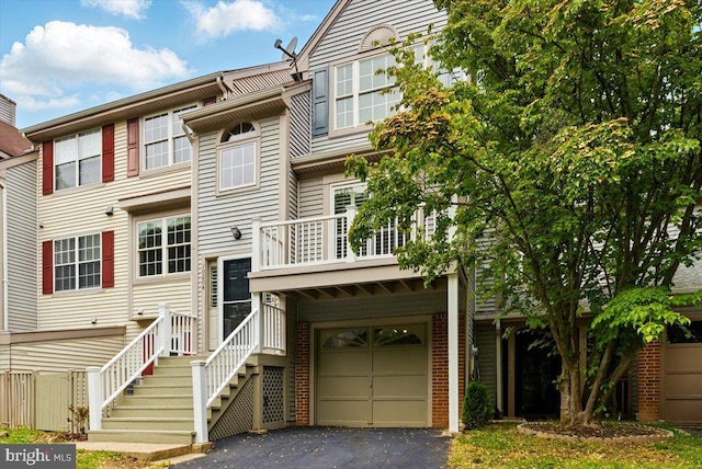 10204 Faire Commons Ct, Burke, VA 22015 - view of front of property featuring driveway, a garage, and a balcony