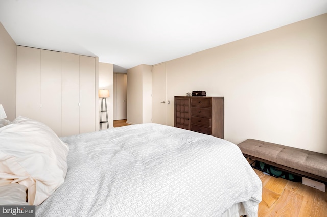 bedroom with wood finished floors