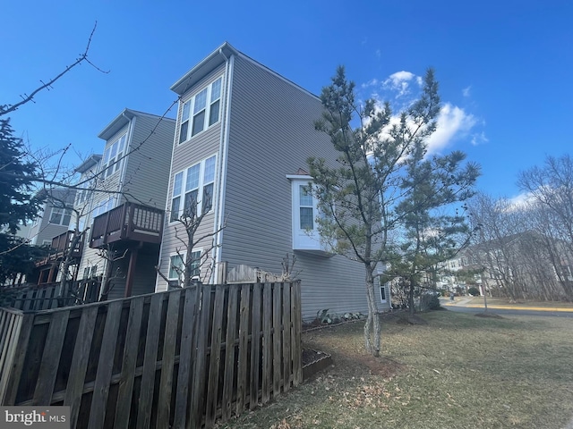 view of side of property with fence