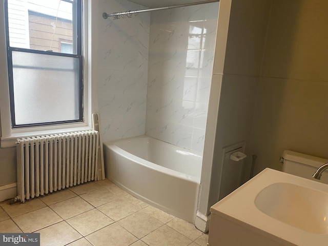 full bath with bathing tub / shower combination, radiator, toilet, tile patterned floors, and a sink