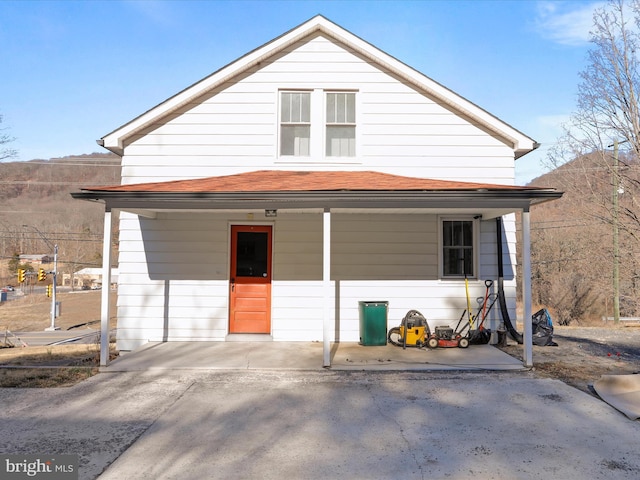 view of front of house featuring roof with shingles