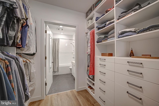 spacious closet featuring visible vents and light wood-style floors