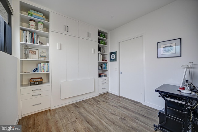 office space featuring wood finished floors