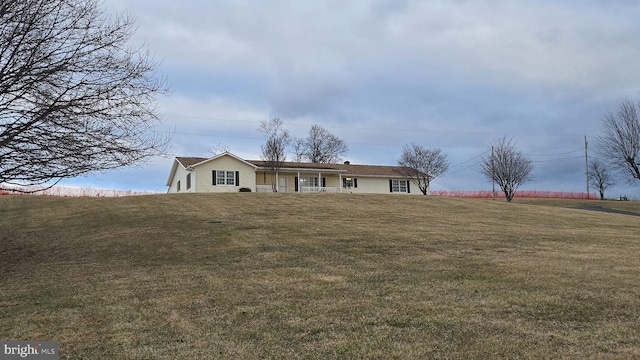 ranch-style home with a front lawn