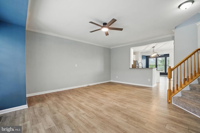 1332 Cranes Bill Way, Woodbridge, VA 22191 - unfurnished living room with ceiling fan, light wood-type flooring, stairway, baseboards, and ornamental molding