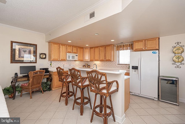 kitchen featuring white appliances, light countertops, visible vents, and light tile patterned floors