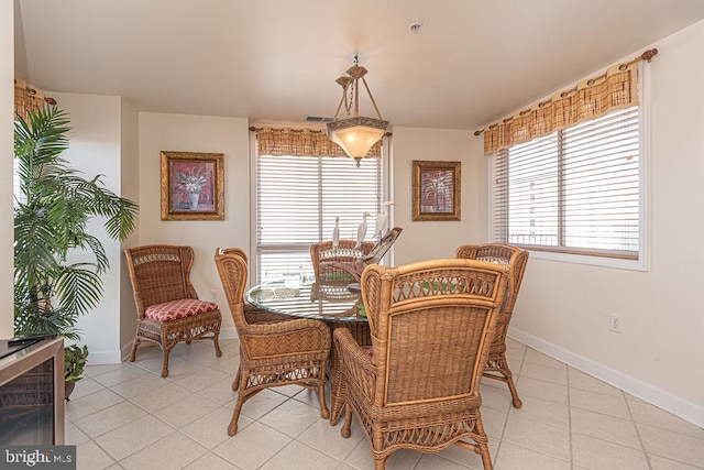 dining room with visible vents, baseboards, and light tile patterned flooring