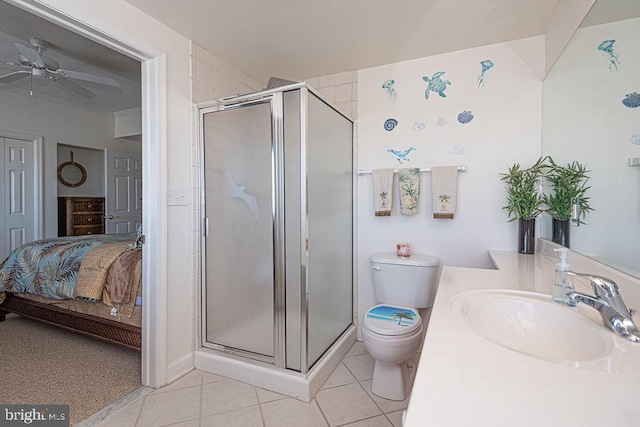 ensuite bathroom featuring toilet, ensuite bathroom, a ceiling fan, a stall shower, and tile patterned floors