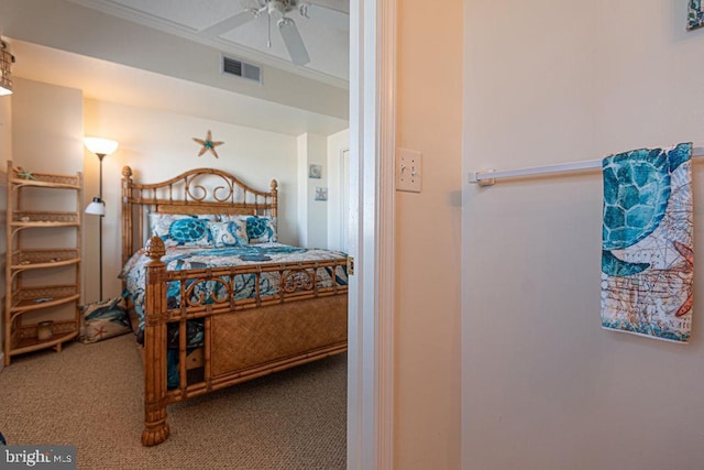 bedroom featuring carpet, visible vents, ceiling fan, and crown molding