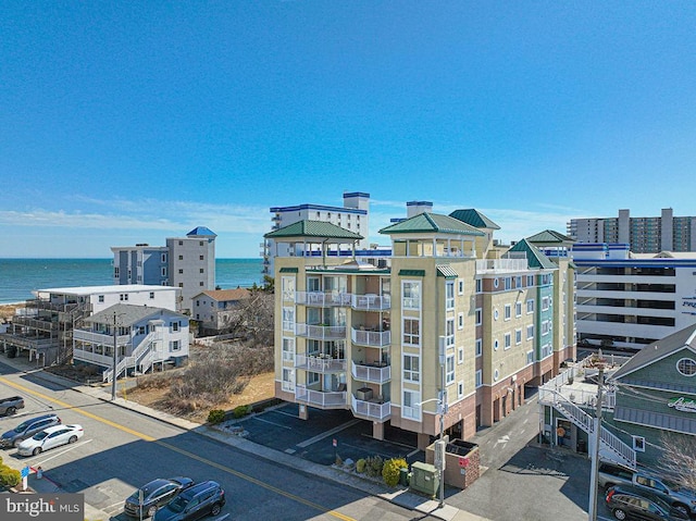 view of property featuring a water view and a city view