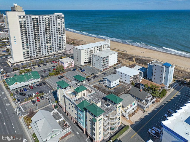 aerial view featuring a water view and a beach view