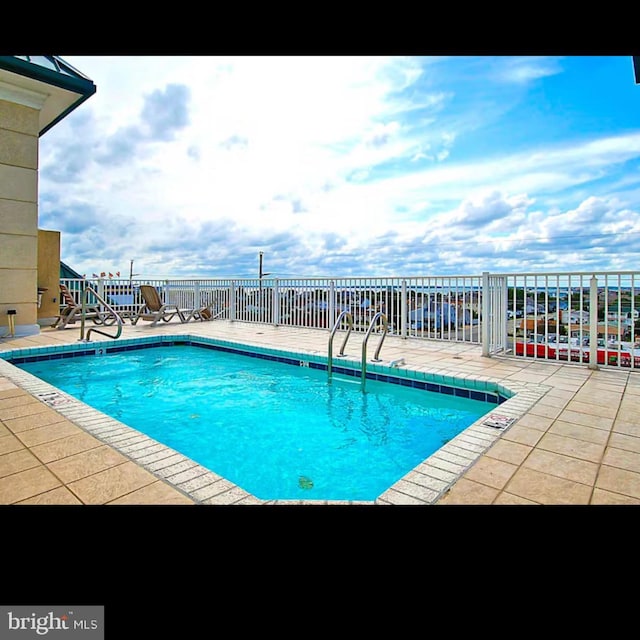 pool featuring a patio area