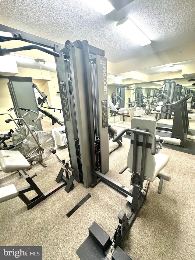 workout area with a textured ceiling