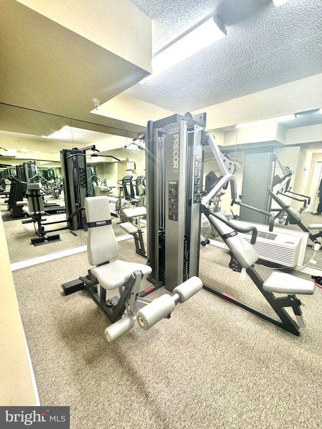 workout area with a textured ceiling