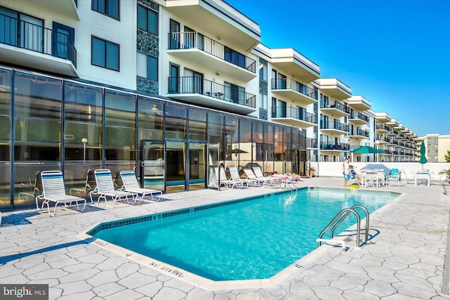 community pool with a patio area