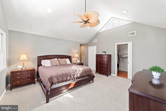 carpeted bedroom with visible vents, baseboards, a closet, and ceiling fan