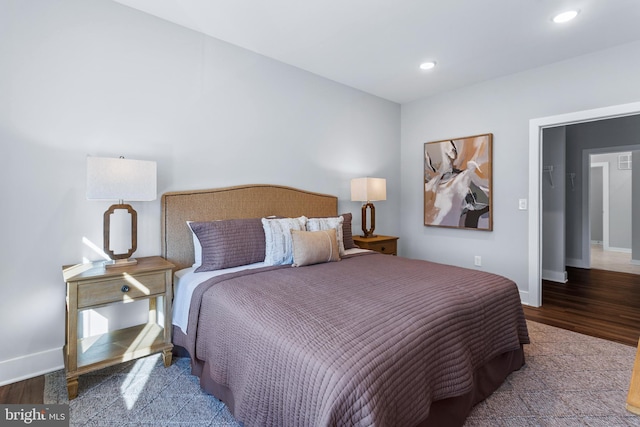 bedroom featuring recessed lighting, wood finished floors, and baseboards