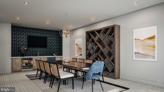 dining room featuring recessed lighting, light colored carpet, an inviting chandelier, an accent wall, and beverage cooler