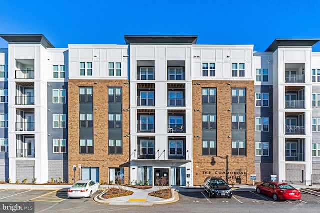 view of property featuring uncovered parking