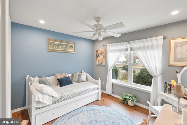 bedroom with a ceiling fan, recessed lighting, baseboards, and wood finished floors