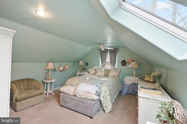 bedroom with carpet floors and vaulted ceiling with skylight