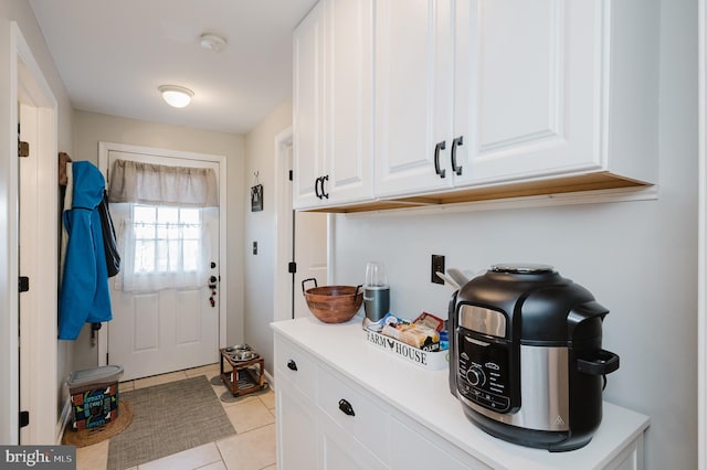 mudroom with light tile patterned floors