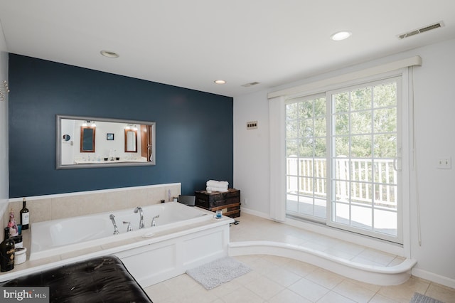 bathroom featuring baseboards, a garden tub, visible vents, and recessed lighting