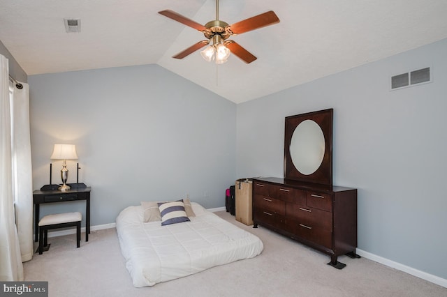 bedroom with lofted ceiling, visible vents, light carpet, and baseboards