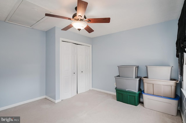 unfurnished bedroom featuring a closet, carpet flooring, ceiling fan, and baseboards