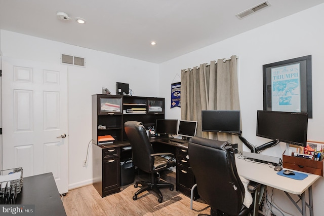 office area featuring light wood-type flooring, visible vents, and recessed lighting