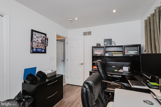 office featuring visible vents, wood finished floors, and recessed lighting