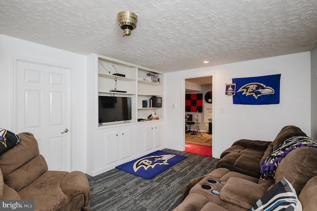 living area featuring carpet floors and a textured ceiling