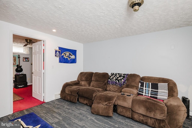 carpeted living room with a textured ceiling and baseboard heating