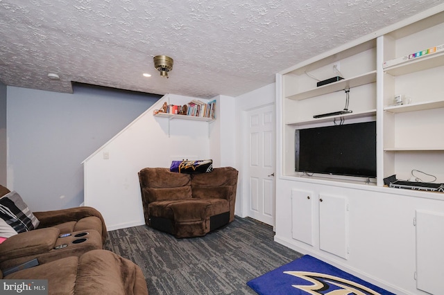 living area with a textured ceiling