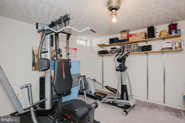 exercise area with a textured ceiling