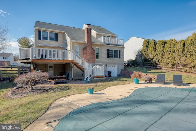 back of house featuring fence, stairs, a wooden deck, a chimney, and a patio area