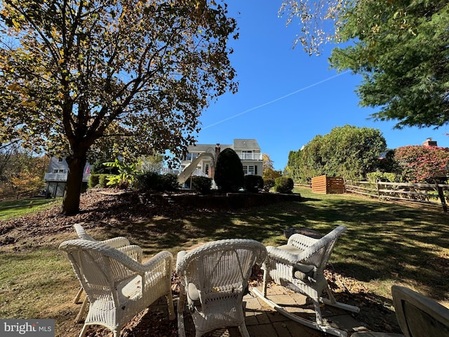 view of yard featuring a patio and fence