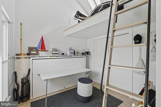 home office with wood finished floors