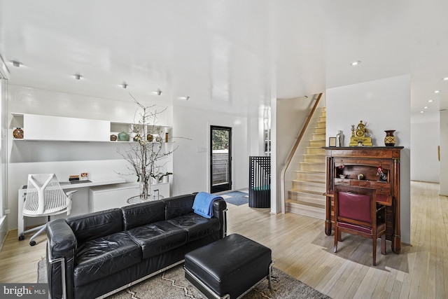 living area featuring stairway, wood finished floors, and recessed lighting