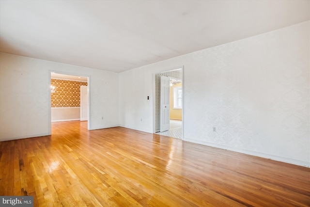 unfurnished room featuring hardwood / wood-style floors