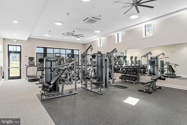 exercise room featuring ceiling fan, visible vents, and baseboards