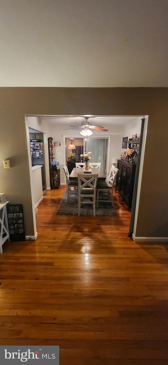 dining area with wood finished floors