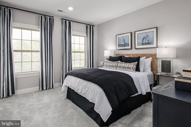 bedroom featuring carpet, visible vents, and baseboards