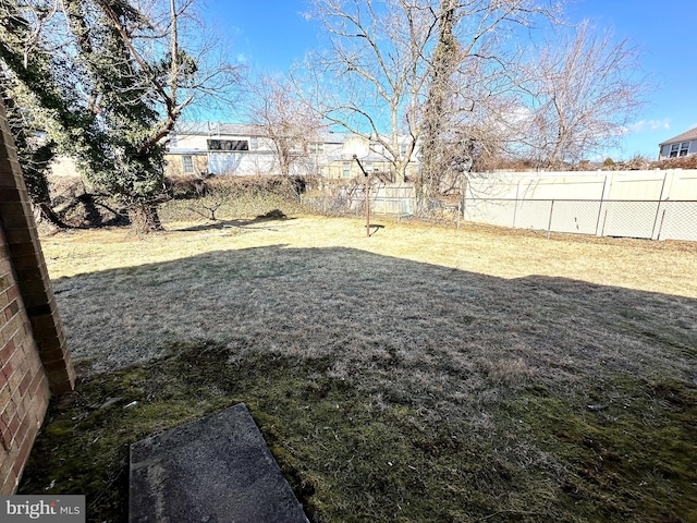 view of yard with a fenced backyard