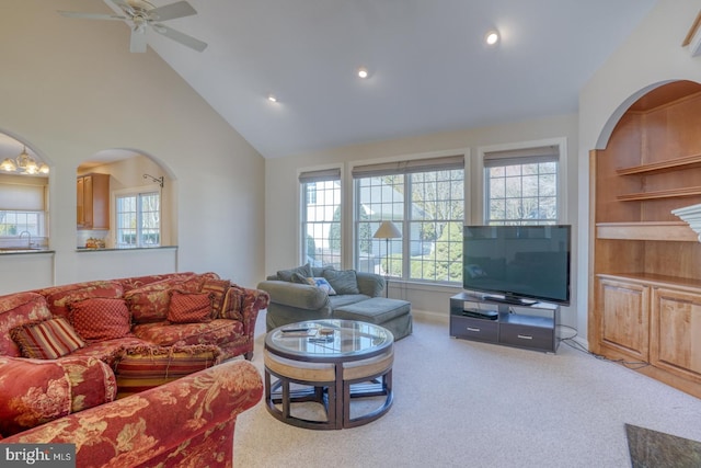 living room featuring high vaulted ceiling, recessed lighting, carpet flooring, and ceiling fan