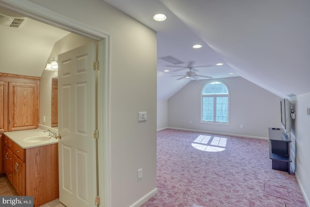 bonus room featuring baseboards, light colored carpet, vaulted ceiling, a sink, and recessed lighting