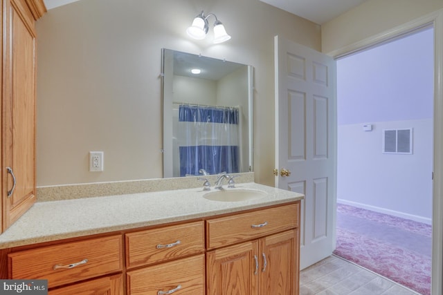 full bathroom with visible vents and vanity