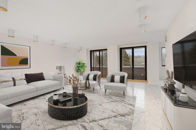 living area with marble finish floor