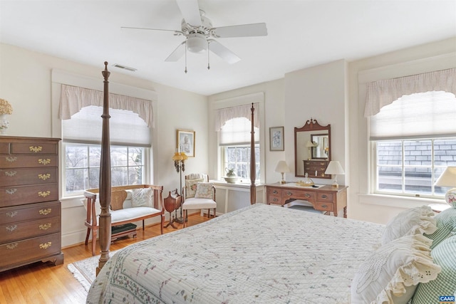 bedroom featuring a ceiling fan, light wood-type flooring, and visible vents